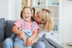 Parent holding child with a developmental disability