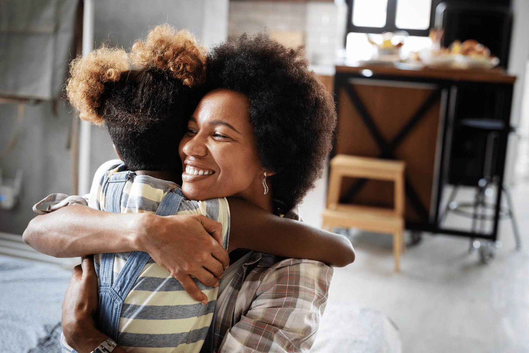 Hugging mom and daughter