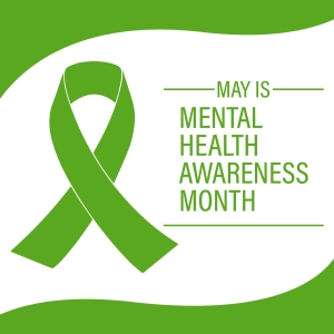 A green awareness ribbon on a white background with green borders. To the right of the ribbon, text reads: “May is Mental Health Awareness Month.”